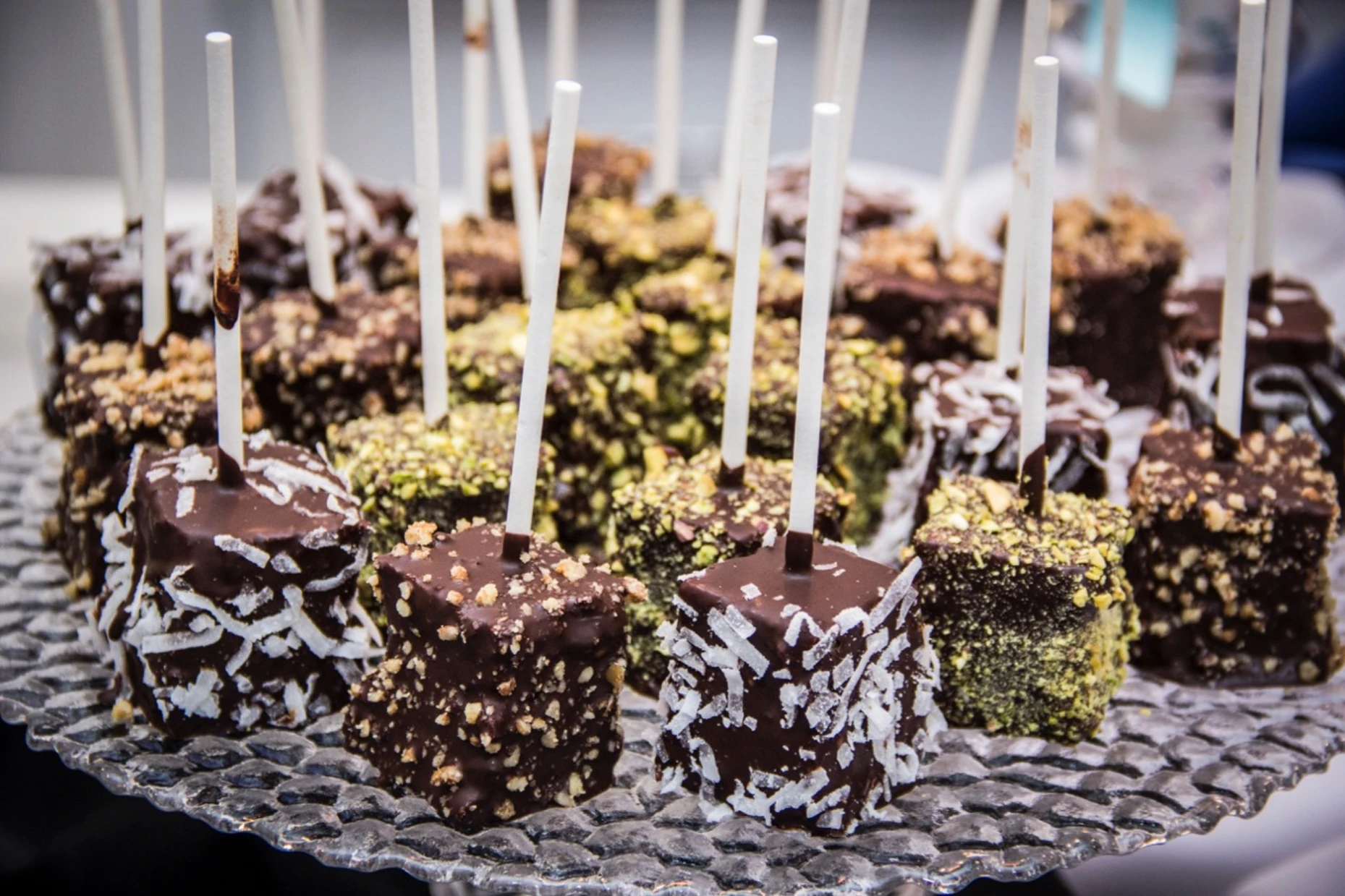 Chocolate-dipped dessert pops with nuts and coconut