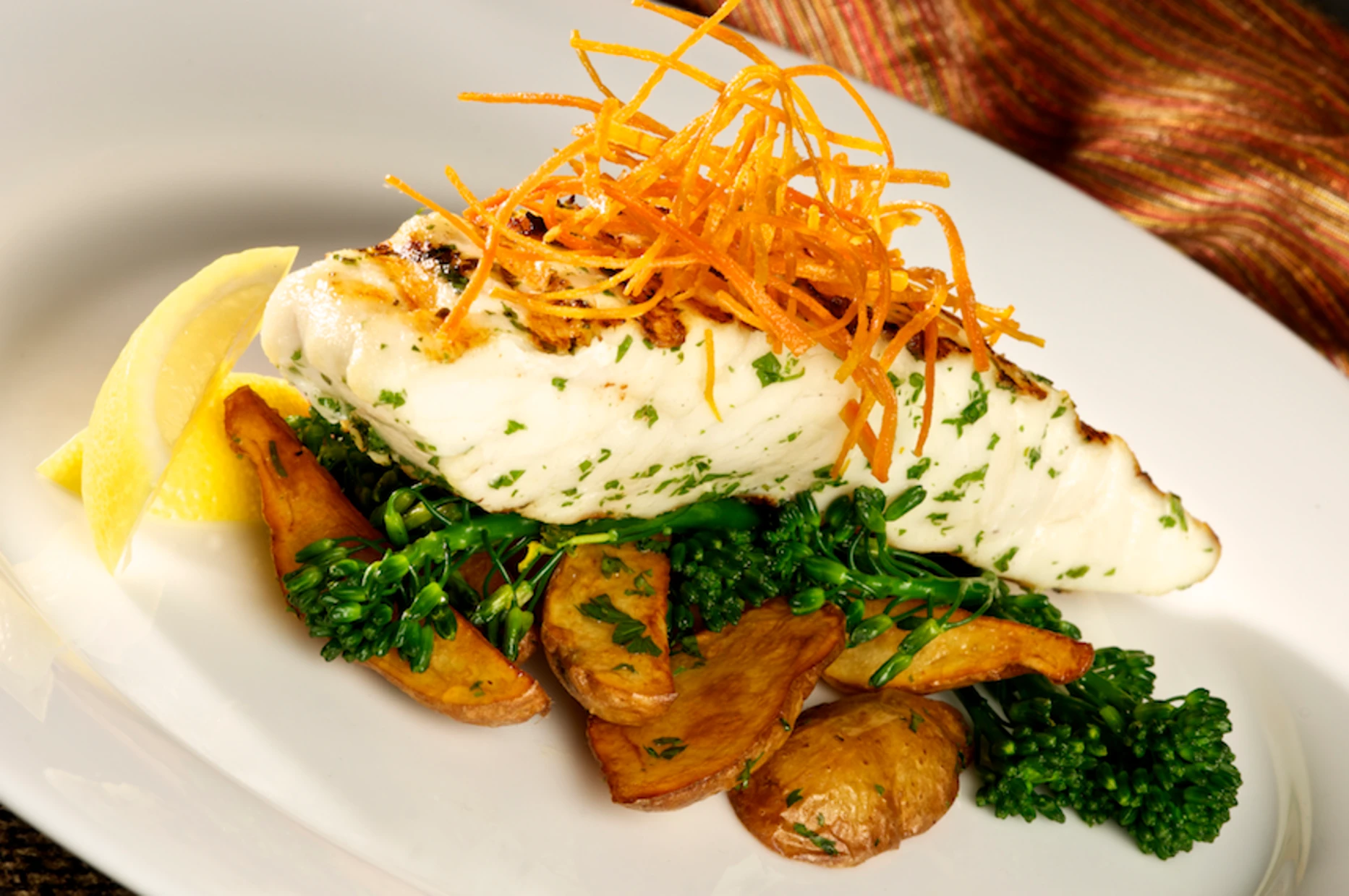 Grilled halibut with broccolini, roasted potatoes and crispy sweet potato threads