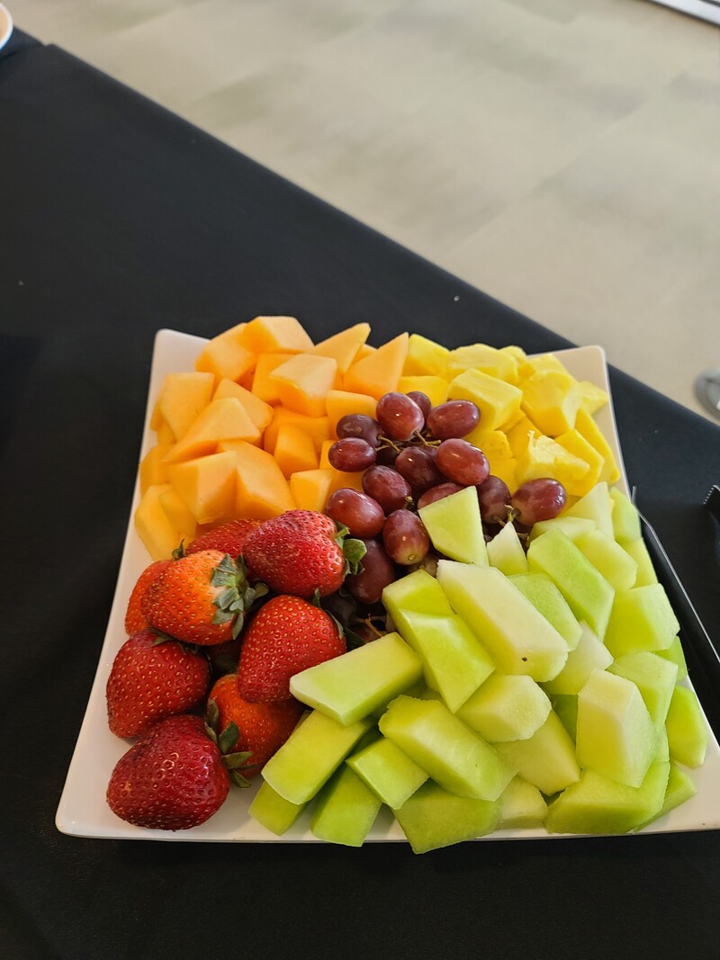 Fresh fruit tray with melon, grapes and strawberries
